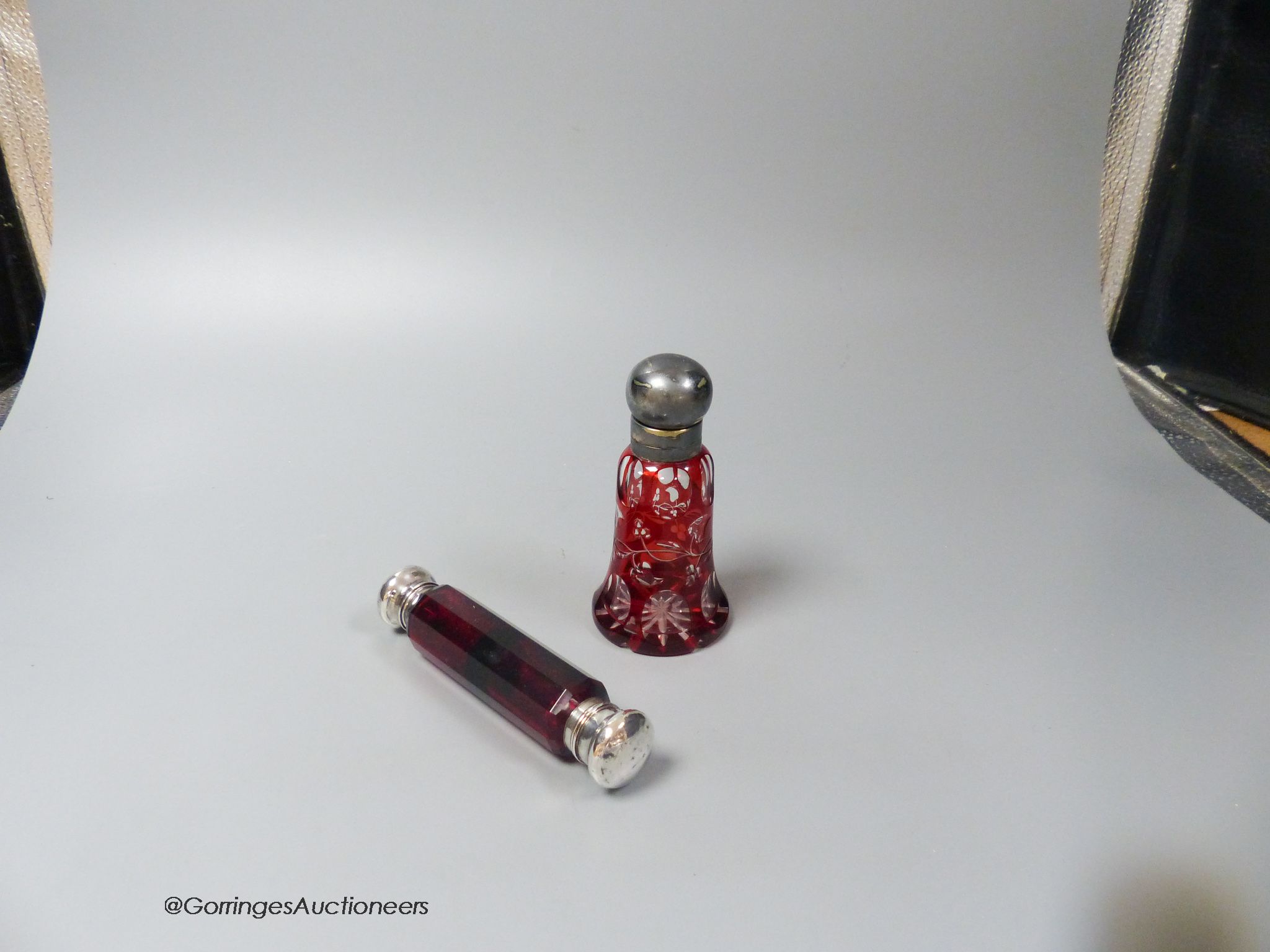 A Victorian ruby glass double silver mounted scent bottle and a plate mounted flash cut ruby scent bottle (2)